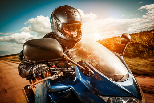 motorcycle rider with helmet