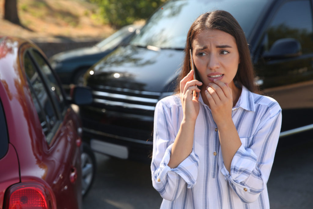 woman on the phone after a rental car accident